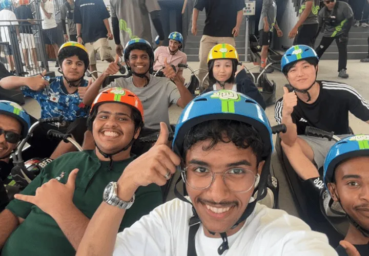 Multicultural group of ELS students having fun at a theme park