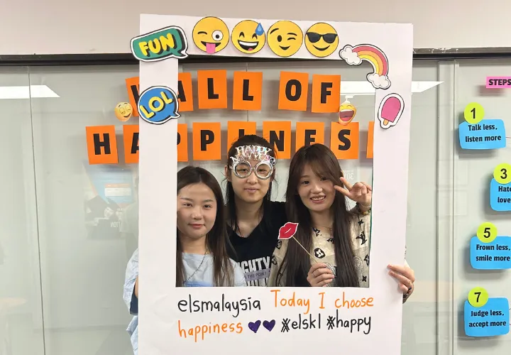 A trio of happy and smiling ELS students 