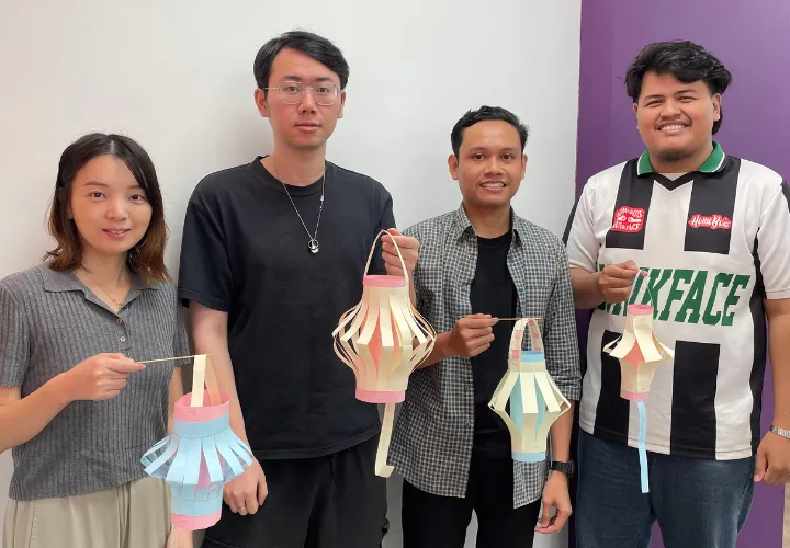 A group of ELS students holding up their handmade paper lanterns
