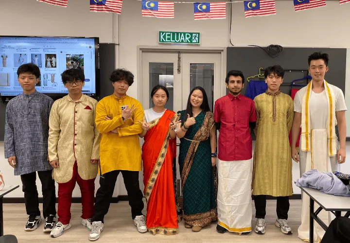 A group of ELS students and staff dressed in traditional clothing