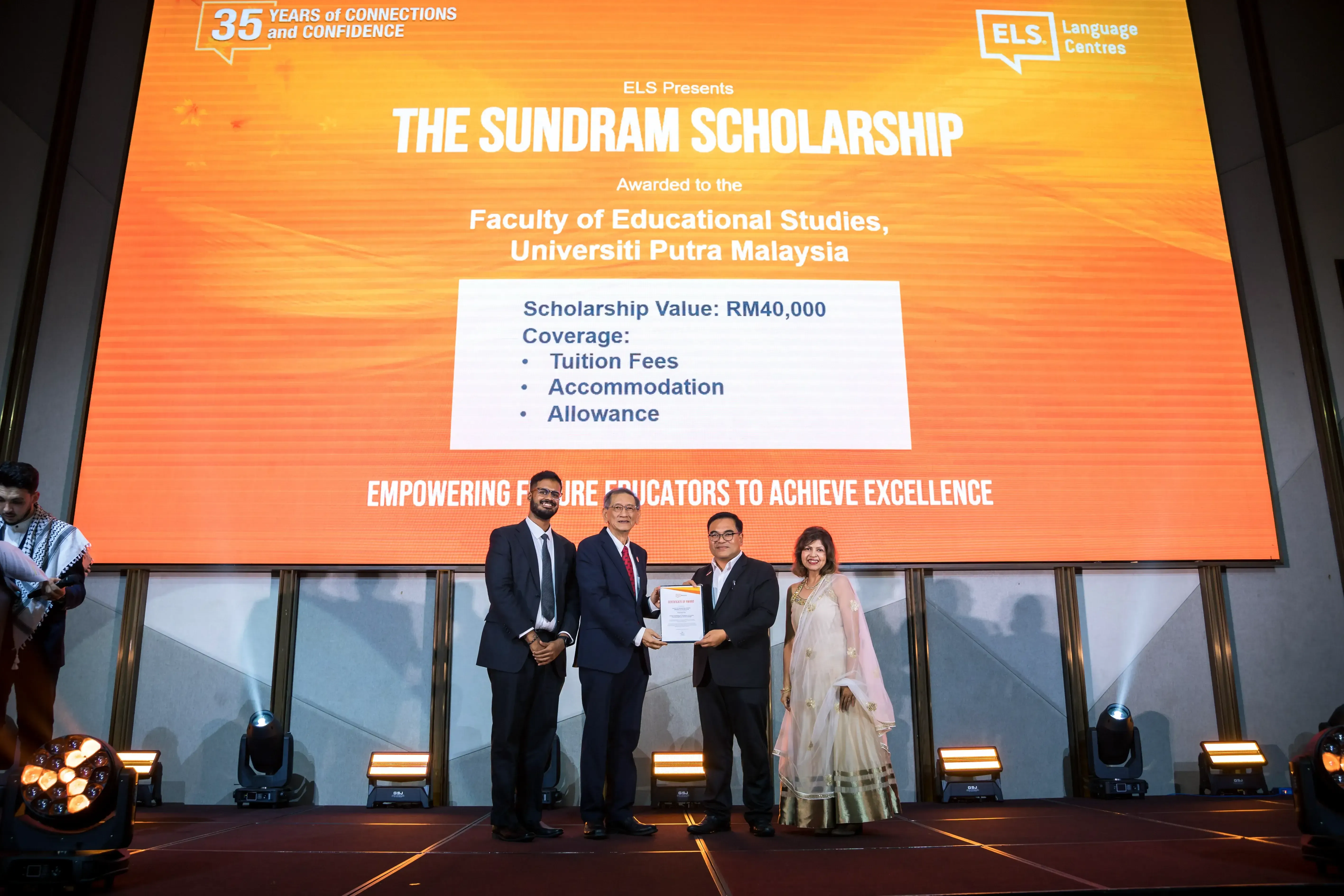 Assoc. Prof. Dr. Wan Marzuki bin Wan Jaafar (Dean FES, UPM) and the grandchildren of the late Mr Sundram, Vikram Hariharan and Mala Sundram onstage.